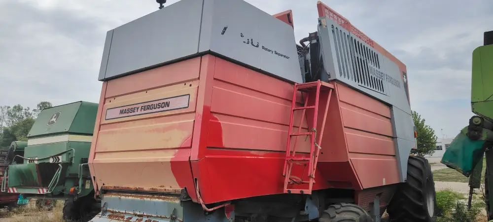 Kombajn MASSEY FERGUSON 7256 sa hederom i kolicima za heder 